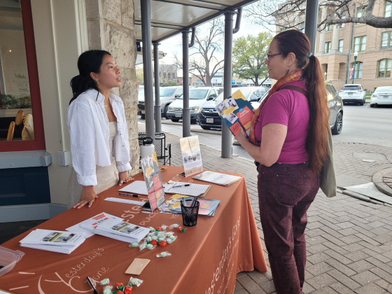 Angela Grill, left, from Yesterday's Gone explains the nonprofit’s mission to temporarily house women who are experiencing trauma and abuse from their partners. Yesterday’s Gone is based in Liberty Hill.