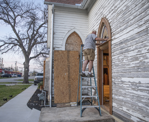 Robert Halstrom puts finishing touches on a door at the former Granger First United Methodist Church  on Monday, March 11, 2024.  Halstrom and his wife JoAnne, a Wimberley couple,  purchased the early-1900s church in late-2019.   Robert has been working on the church since then, with plans to eventually transform it into an event venue.   The work slowed after his wife was seriously injured after being struck by a vehicle in spring 2022, but the work continues.