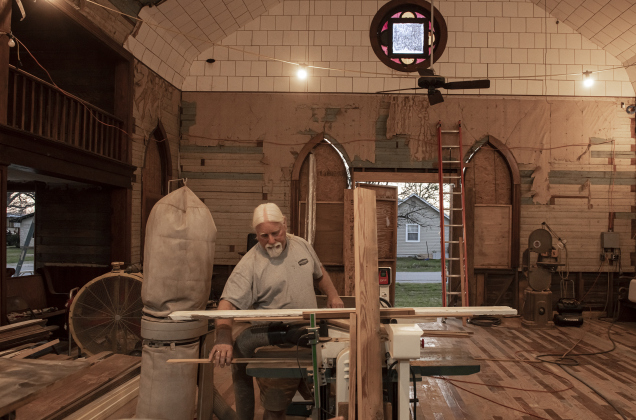 Robert Halstrom works in what was once the sanctuary  at the former Granger First United Methodist Church  on Monday, March 11, 2024.  Halstrom and his wife JoAnne, a Wimberley couple,  purchased the early-1900s church in late-2019.   Robert has been working on the church since then, with plans to eventually transform it into an event venue.  Photo by Andy Sharp. 