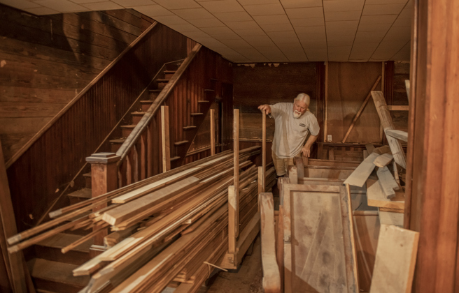 Robert Halstrom makes his way through lumber after closing windows  at the former Granger First United Methodist Church  on Monday, March 11, 2024.