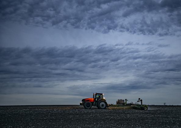 With his night lights shining, a farmer works a field along F.M. 619 a little north of U.S. 79  on Wednesday, February 28.    Photo by Andy Sharp