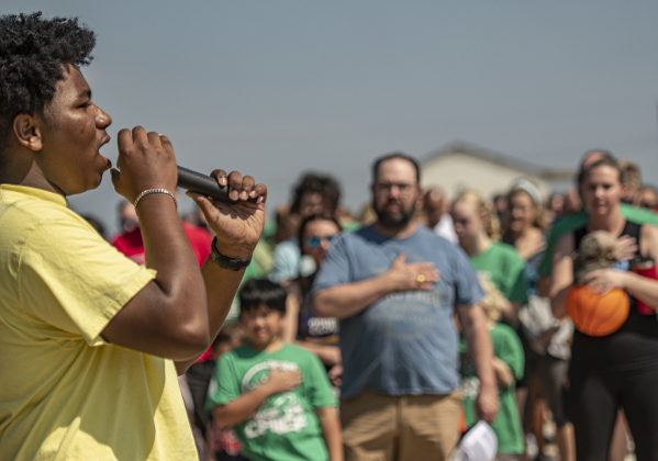 Georgetown High student Kamrin Gordon, 17, sings  the Star-Spangled Banner before the races begin.