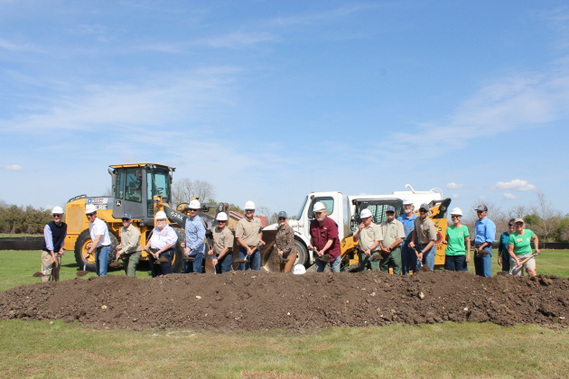 Valerie Covey, Williamson County Precinct 3 Commissioner, center, is joined by the Wilco Parks Department, contractors and community members to break ground on the improvement projects for Berry Springs Park and Preserve on Friday, March 8.   Photo by Nalani Nuylan. 