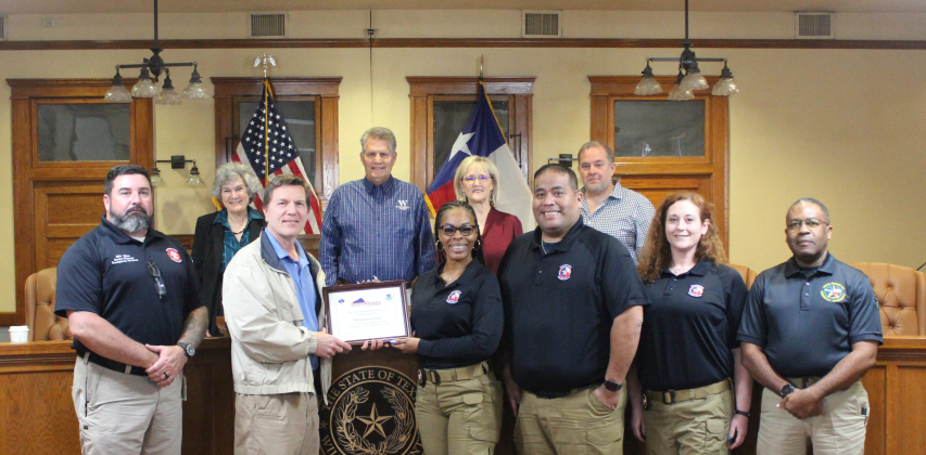 The Williamson County Office of Emergency Management stands with Paul Yura, left, and the county commissioners after being designated as a Storm Ready community. Photo courtesy of Williamson County.