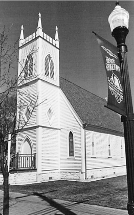 The Grace Heritage Center captured in 1995, a few years after it moved onto the Square. Stenciled windows can be seen on the side of the building. (Sun Archive)