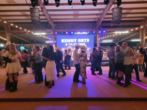 Attendees take to the dancefloor while Kenny Orts and No Chance play classic country songs to dance to.