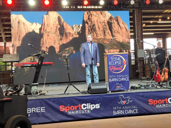 Singer Steve Amerson sings “The Star-Spangled Banner” and “America the Beautiful” to begin the Barn Dance.