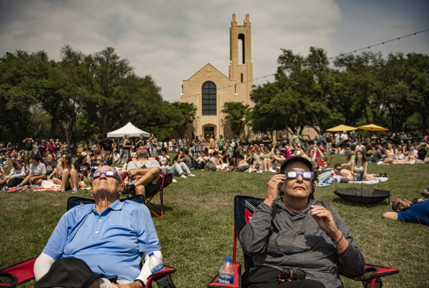 im Bakken, left, is joined by his wife Sandy as they view the skies about three minutes before totality.