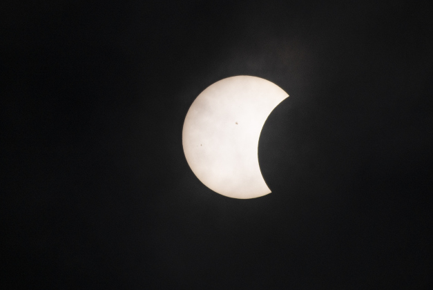 The moon's shadow continues to cover the sun's surface at 12:45p.m. on Monday, April 8.