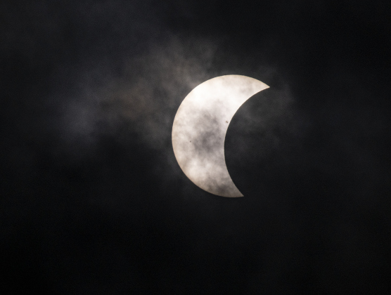 The moon's shadow continues to cover the sun's surface at 1 p.m.  on Monday, April 8.