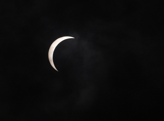 The moon's shadow mostly covers the sun's surface at 1:25 p.m. on Monday, April 8 during a total eclipse.