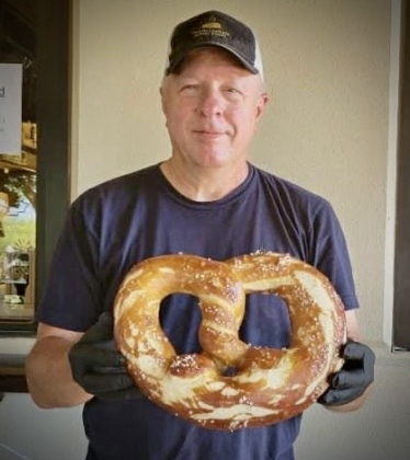 H.L. Fahnestock at Rentsch Brewery Oktoberfest 2022 with a 2 1/2 lb pretzel he made for the event.