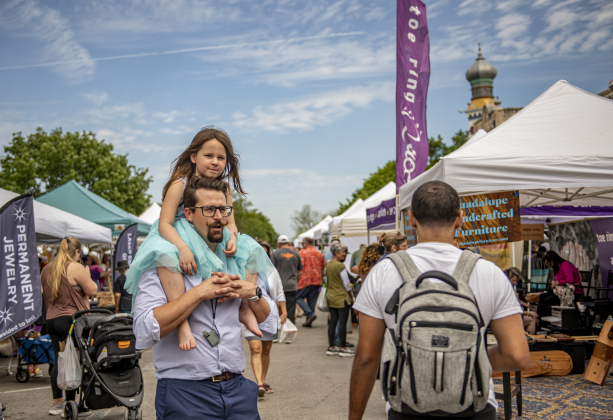 Robert Bedford gives a shoulder ride to daughter Sophie, 7, as they stroll along Main Street during Market Days, held Saturday, April 13.
