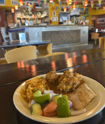 An order of Namaste’s Nepali style of Chicken Curry, Cabbage Masala, Kachumber salad and naan. 