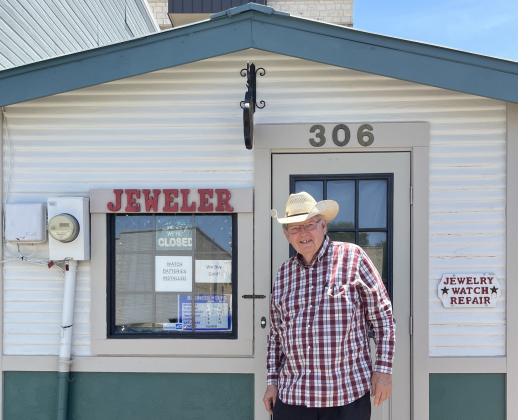 Linzy Bandy stands in front of his jewelry store and repair shop.