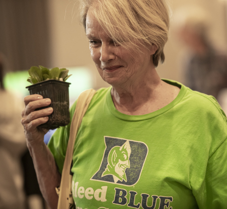 Nancy Adair holds a Lyre Leaf Skullcap plant she received from the Sun City Plant Club during Sun City's Earth Day Celebration event held at The Retreat in Sun City on Monday, April 22. The event was hosted by Sun City Texas Recycles. The first Earth Day was on this date in 1970.  PhotoS by Andy Sharp