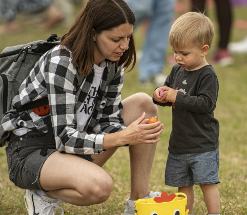 Hanna Kazymirko helps her 18-monht-old son David look through the eggs he collected during the annual Easter egg hunt at Georgetown Church of the Nazarene on Saturday, March 30, 2024.