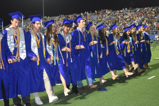 For the last time, seniors sing the school song.