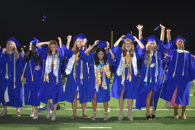 Georgetown High School students wait with anticipation for the very end of their graduation ceremony.