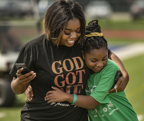 10-year-old Nakayla Johnson, a student at Mitchell Elementary School, gets a hug from her mom Jazmyne Johnson after Nakayla competed in a track event during the Georgetown Independent School District's annual Special Olympics, held Tuesday, May 7, 2024  at the district sports complex behind Georgetown High School.     Photo by Andy Sharp.