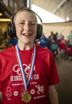 14-year-old Tray Crary, a student at Forbes Middle School, proudly poses with a medal he won during the Georgetown Independent School District's annual Special Olympics, held Tuesday, May 7, 2024  at the district sports complex behind Georgetown High School.     Photo by Andy Sharp.