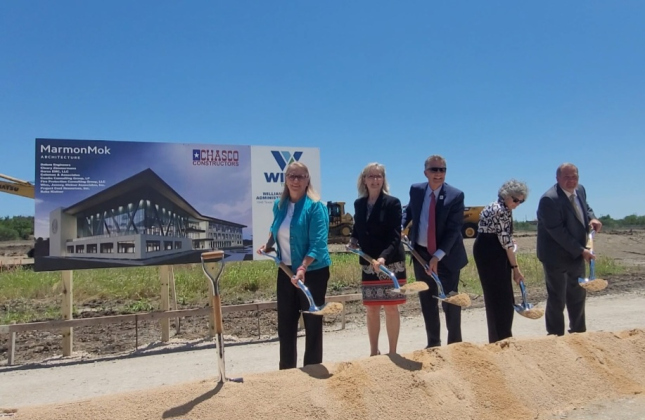 County Commissioners Cynthia Long, Valerie Covey, County Judge Bill Gravell, Commissioners Terry Cook and Russ Boles break ground on the property on the new county headquarters.