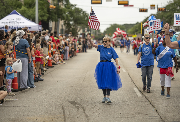 Susan N. Johnson, a member of the Sun City Democrats, joined her group in the parade along Austin Avenue during the 25th Annual Red Poppy Festival.