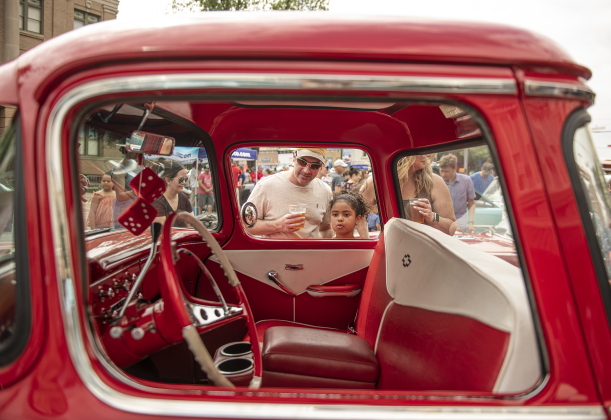 Brad Koch and his daughter Addison, 7, take a look inside a 1957 Chevrolet truck owned by Jane Lien during the car show segment of the  25th Annual Red Poppy Festival.