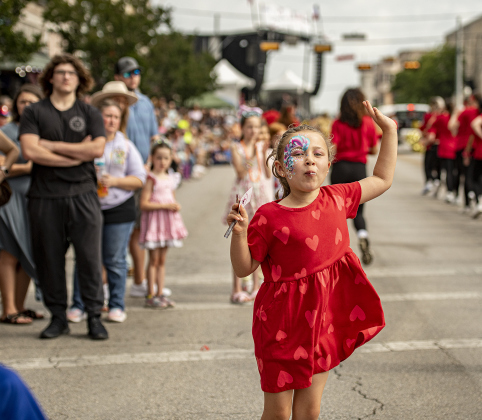 6-year-old Alyssa Coy had fun at the parade along Austin Avenue during the 25th Annual Red Poppy Festival on Saturday, April 27, 2024.    Photo by Andy Sharp.