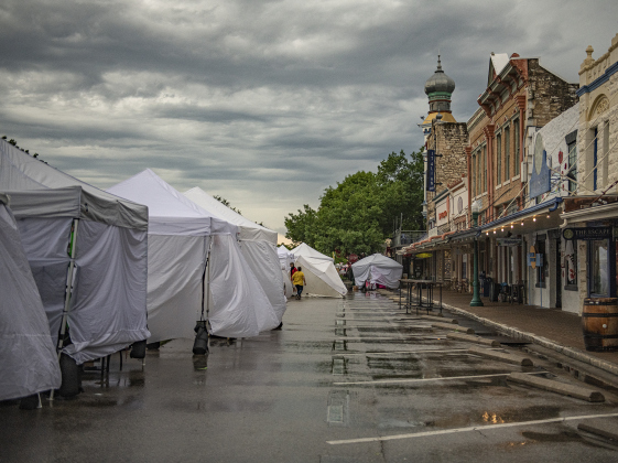 Main Street was soaked before vendors opened  on Sunday morning, April 28, 2024, the last day of the 25th Red Poppy Festival.