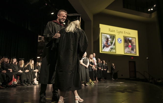 Principal Rob Dyer congratulates graduating senior Rain Ervin as she walks across the stage to receive her diploma during  the 2024 Richarte High School Commencement held at the Rodney and Mary Klett Performing Art Center on Thursday, May 23.