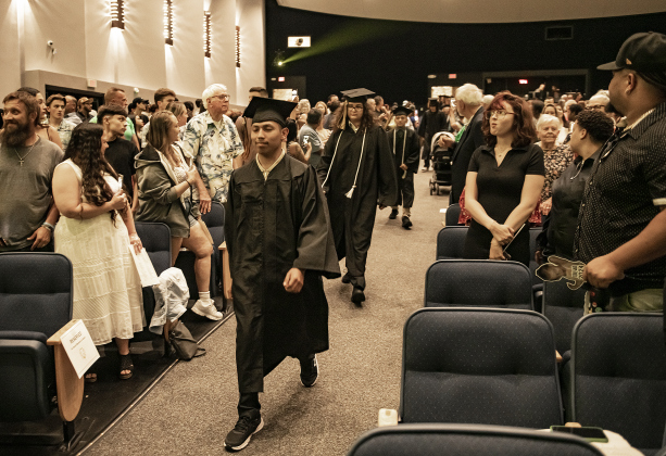 Attendees stand for the processional during the 2024 Richarte High School Commencement held at the Rodney and Mary Klett Performing Art Center on Thursday, May 23, 2024. 62 seniors received their diploma tonight, with the total expected to reach 77 total graduates by the end of summer.