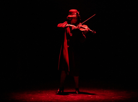 Violinist Antonette Knoedl  introduces a scene in a Thursday, May 30, 2024 photo from the dress rehearsal of the Georgetown Palace production of "Bright Star," playing through June 30th on the Springer Stage.     Photo by Andy Sharp.