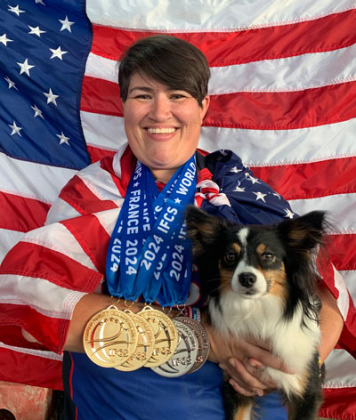 Courtney Moore of Leander poses with her Border Collie/Papillon mix “Butter” after winning five medals at the 2024 World Agility Championship in France in May. Photo courtesy of The United States Dog Agility Association.
