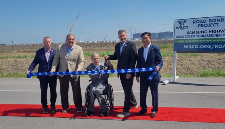 From left to right, TxDOT Engineer Tucker Ferguson, County Commissioner Russ Boles, Governor Greg Abbott, County Judge Bill Gravell and President of the Samsung construction team Dr. CH Park pose to cut the ribbon opening the Samsung Highway.