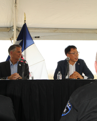 Dr. CH Park, left, president of the Samsung construction team, gives his thanks to the county on behalf of Samsung during the ribbon cutting.