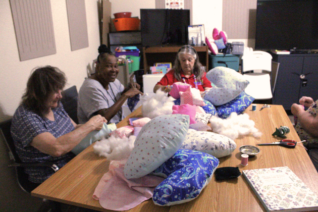 The Jarrell Sewing Group meets on Wednesday mornings to sew pillows for breast cancer patients in the library.