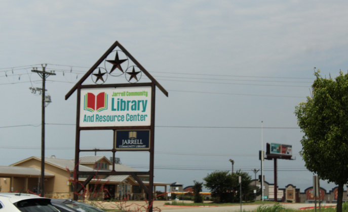 The sign on Limestone Terrace in Jarrell tells the city and Sonterra MUD residents the library is waiting for them.