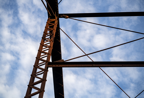 Warm late-day light falls on support beams of the  truss bridge along County Road 366 in the Rowe Valley area on Tuesday, June 11, 2024.