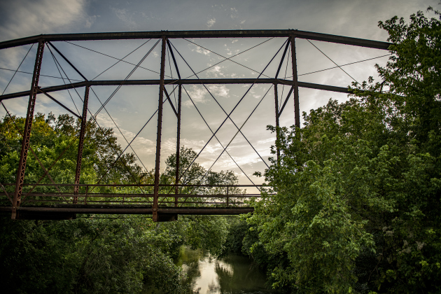 The San Gabriel River flows beneath the long-retired truss bridge along County Road 366 in the Rowe Valley area on Tuesday, June 11, 2024.