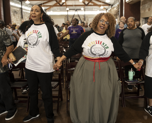 Pastor Harriet Jones, left, with Saving Grace Christian Bible Fellowship, holds hands with Georgetown Cultural Citizen Memorial Association President Regina Durden, right, as they sing the closing program song "Reach Out and Touch" during the group's 72nd Annual Juneteenth Celebration on Saturday, June 15, 2024.