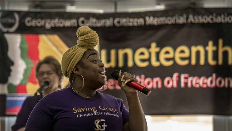 Kolina Turner, a member of the choir at Saving Grace Christian Bible Fellowship sings "Oh Happy Day" during the Georgetown Cultural Citizen Memorial Association's 72nd Annual Juneteenth Celebration on Saturday, June 15, 2024.