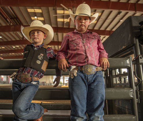 6-year-old Cade Cantu, left, is joined by his brother Cash, 8, as Cade gets ready to to compete in Mutton Bustin' at the 1st Annual Bill Pickett Youth Rodeo, held at the Williamson County Expo Center  on Saturday, June 15, 2024.   The rodeo was open to entrants 18-years-old or younger.    Photo by Andy Sharp. 