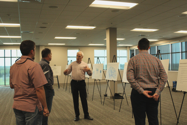 Rob Faubion, center, answers questions from Wilco residents about the Atlas 14 preliminary results at the May 29 meeting at the Georgetown Annex. Photo by Nalani Nuylan.