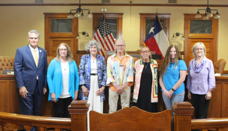 Former City of Florence Mayor Mary Condon, center left, stands with her family and the Williamson County Commissioners at the June 25 meeting at the historic courthouse. Photo courtesy of Williamson County.