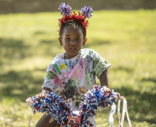 5-year-old Faith Warwick gets ready to  ride in the Hometown Parade in San Gabriel Park on Thursday, July 4, 2024.  The Georgetown Sertoma Club sponsors the 4th of July Freedom Festival each year in San Gabriel Park.  Photo by Andy Sharp.
