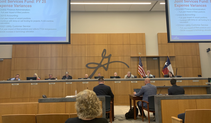Assistant city managers, front, from left, Nick Woolery and Wayne Nero along with Assistant Finance Director Nathan Parras present budget propositions to city council with Assistant City Manager Laurie Brewer (not pictured). (Photo by Kaitlyn Wilkes)