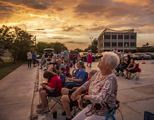 Georgetown resident Nancy Marsac, front, joined others to spot Mexican Free-tailed bats around the McNeil Street bridge on Saturday, July 13. A group came out to observe the bats from a nearby vacant lot. Members of the Texas Master Naturalists, Good Water Chapter, were on hand to discuss the bats.
