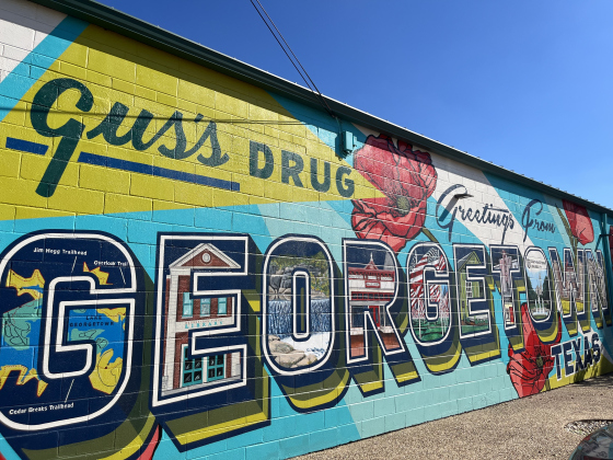 The Greetings From Georgetown mural is on the Walnut Street side of Gus’ Drugs, 702 East University Avenue. 