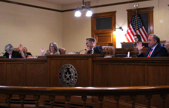 The Williamson County Commissioners Court approves the Secretary of State Election Advisory on ballot numbering during the meeting. Photo by Nalani Nuylan.